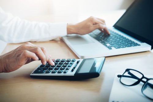finances saving economy concept female accountant banker use calculator scaled